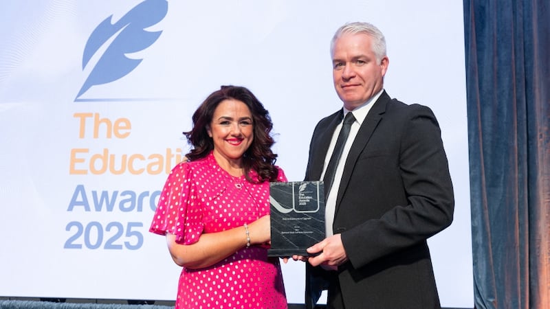 Denise McMorrow, awards judge, presents the best infrastructure upgrade to Robert Ward, NCI