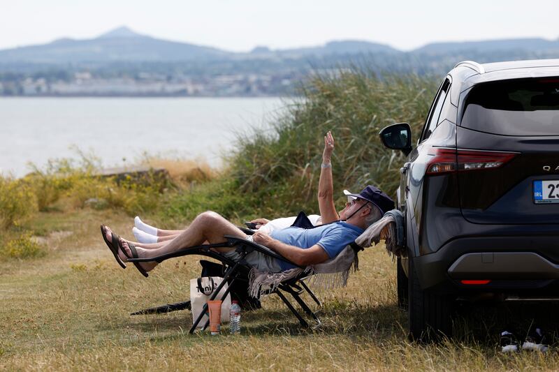 People cooling off by the sea in Dublin earlier this week. Photograph: Nick Bradshaw/The Irish Times