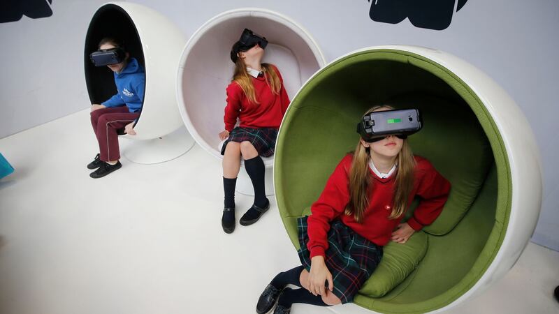 Rose Martin, St Fiachra’s, Beaumont; Naoise Clarke Carr; and Helena Lund, both Ratoath College, Co Meath, enjoying the Virtual Reality display. Photograph: Nick Bradshaw
