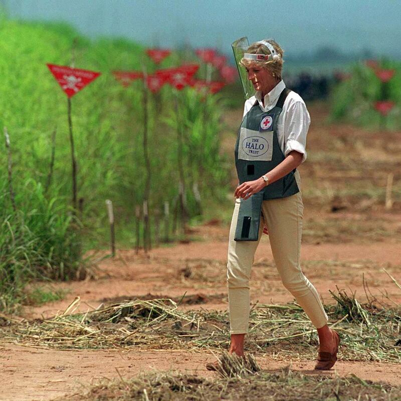 Diana walks down a safety corridor of a minefield in Angola in 1997. Photograph: Tim Graham Photo Library via Getty