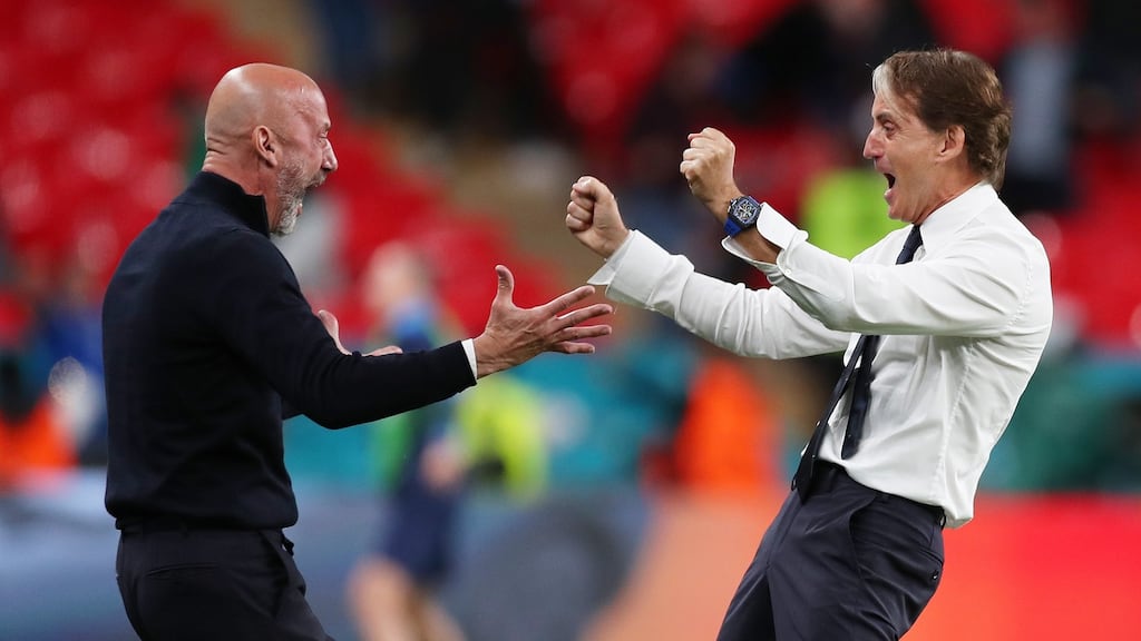 Roberto Mancini celebrates with Gianluca Vialli after their side’s second goal during the match between Italy and Austria at Wembley Stadium. Photograph: Getty