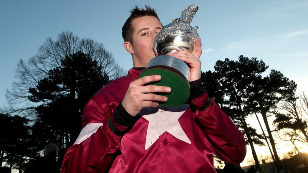 Bryan Cooper celebrates winning the Lexus Steeplechase with Road To Riches at the Leopardstown Christmas Festival in Dublin. Photograph: James Crombie/Inpho