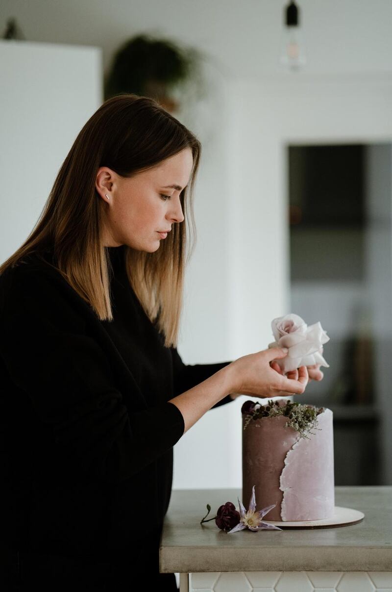 Putting the finishing touches to a Fern Cakery cake