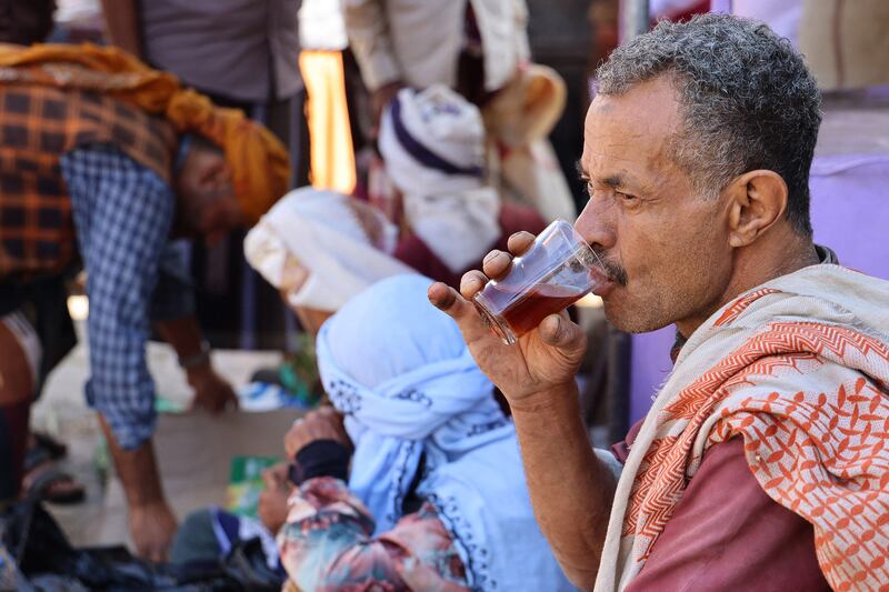 A man drinks tea at a street market in Yemen's third city of Taiz. Photograph: Ahmad Al-Basha /AFP via Getty Images