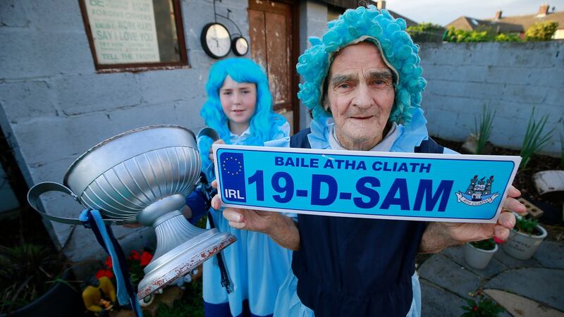 Tony Broughan with his grandson Tighe, who will carry on the family tradition and dress as Molly Malone when attending Dublin’s matches. Photograph:    Nick Bradshaw