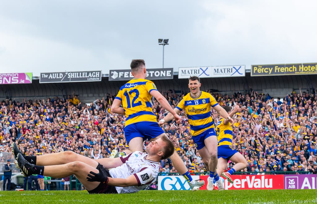 Roscommon’s Darragh Heneghan celebrates with Diarmuid Murtagh as Galway goalkeeper Conor Flaherty displays his disappointment during Sunday's Connacht Senior Football Championship final at Dr Hyde Park, Roscommon. Photograph: James Crombie/Inpho