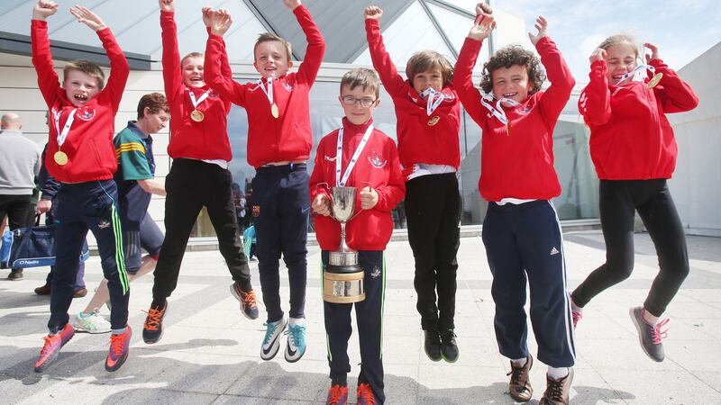James Harrington (centre), captain of the under-10 draughts team from Gaelscoil Uí Riordain, Ballincollis, Co Cork, with his team after they won gold  in the  Games. Photograph: Leon Farrell/Photocall Ireland.