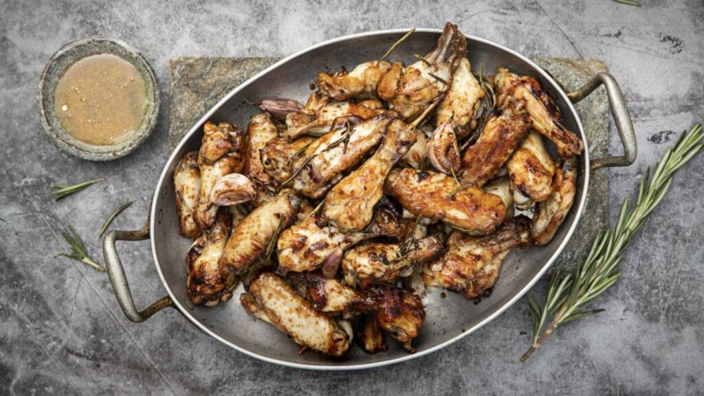 Chicken wings with roasted garlic, balsamic, rosemary and olive oil. Photograph: Harry Weir
