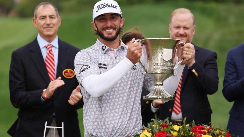 Max Homa celebrates with the trophy after winning  the Wells Fargo Championship at TPC Potomac  in Maryland. Photograph:  Gregory Shamus/Getty Images