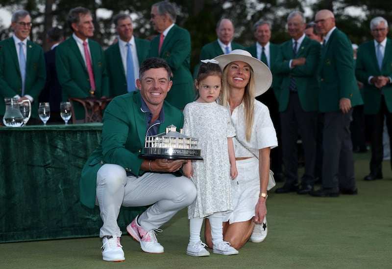 Rory McIlroy with his daughter, Poppy, and wife, Erica, after winning the Masters. Photograph: Richard Heathcote/Getty Images