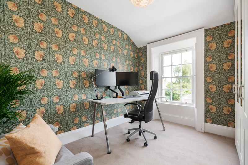 The fourth bedroom is on the top floor and is currently being used as a spacious study/home office
