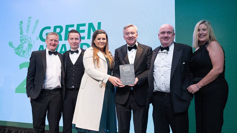 Brian O'Kennedy, managing director, Clearstream Solutions, presents the Green Construction Award to the BAM Ireland team.
