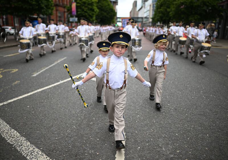 Orangemen and band members take part in the annual Twelfth of July parade in Belfast. Photograph: Charles McQuillan/Getty Images