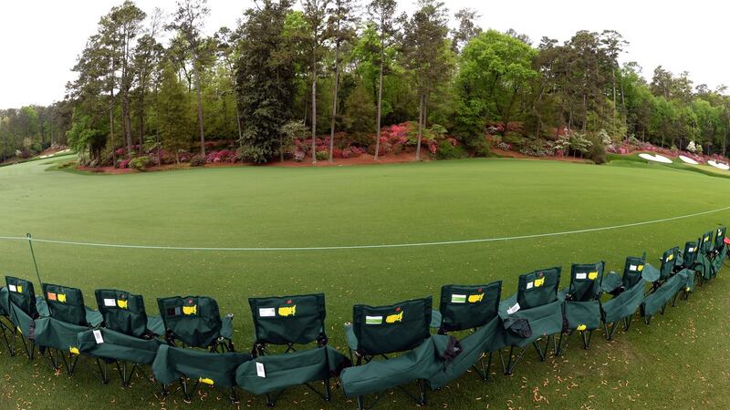 Patrons line up chairs on Amen Corner. Photograph:  Don Emmert/AFP/Getty Images