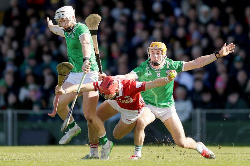 Cork's Alan Connolly is challenged by Limerick's Cian Lynch and Adam English during the NHL Division 1A final. Photograph: Laszlo Geczo/Inpho