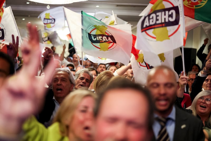 Supporters of far-right party Chega celebrate  at their headquarters in Lisbon. Photograph:  Andre Dias Nobre/AFP via Getty Images         