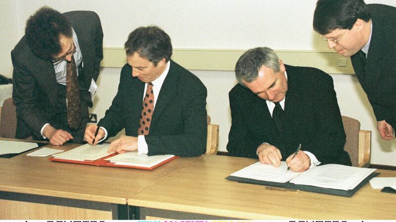 Former British prime minister Tony Blair and former taoiseach Bertie Ahern signing the Belfast Agreement. Photograph: Reuters