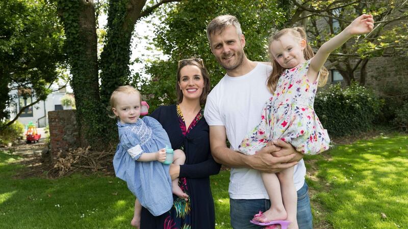 Padraig and Julie Neylon with young Theola and Kara at home on Frances Street, Kilrush. Photograph:  Eamon Ward