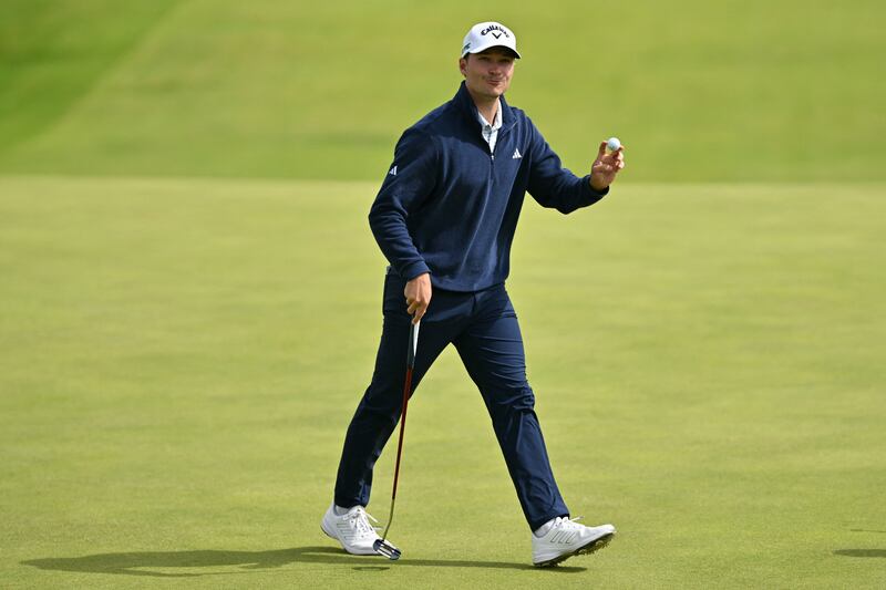 Denmark's Rasmus Hojgaard reacts to making his putt on the 11th green. Photograph: Andy Buchanan/Getty