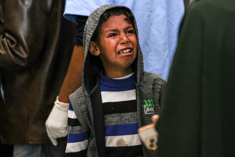 A boy cries at the European hospital morgue in Khan Yunis on the southern Gaza Strip. Photograph: Said Khatib/AFP via Getty Images. 