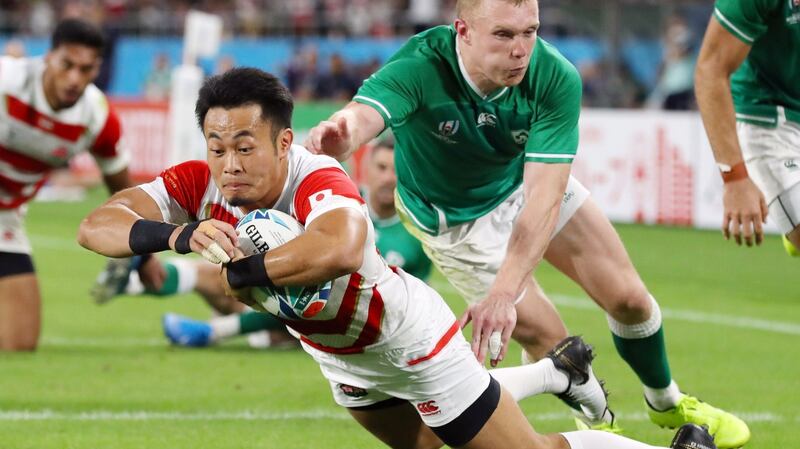 Kenki Fukuoka gets over for a try despite the attempts of Ireland’s Keith Earls at the Ecopa stadium. Photograph:  EPA/JIJI