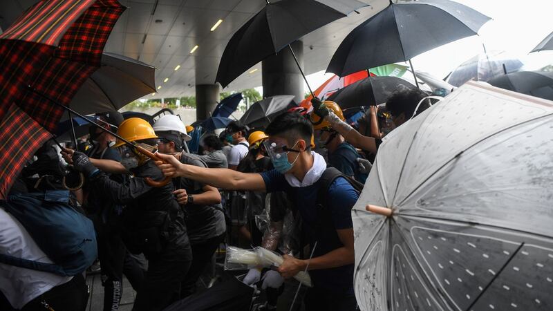 Protesters and police clash during a demonstration outside the Legislative Council complex in Hong Kong on Wednesday. Photograph: Anthony Wallace/AFP/Getty Images