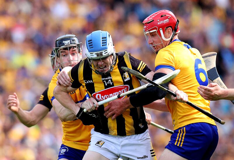 Tony Kelly and Jon Conlon converge on TJ Reid. Photograph: Bryan Keane/Inpho