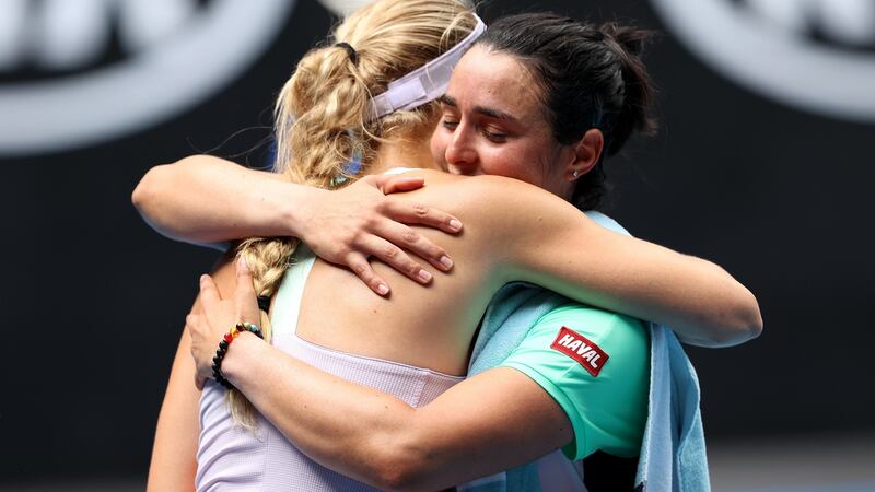 Wozniacki and Ons Jabeur embrace after their match. Photo: Clive Brunskill/Getty Images