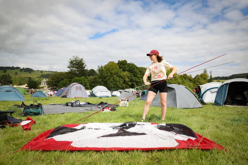 Mary O'Donovan from Crosshaven, Co Cork sets up her tent at Curraghmore Estate, Co Waterford. Photograph: Dan Dennison