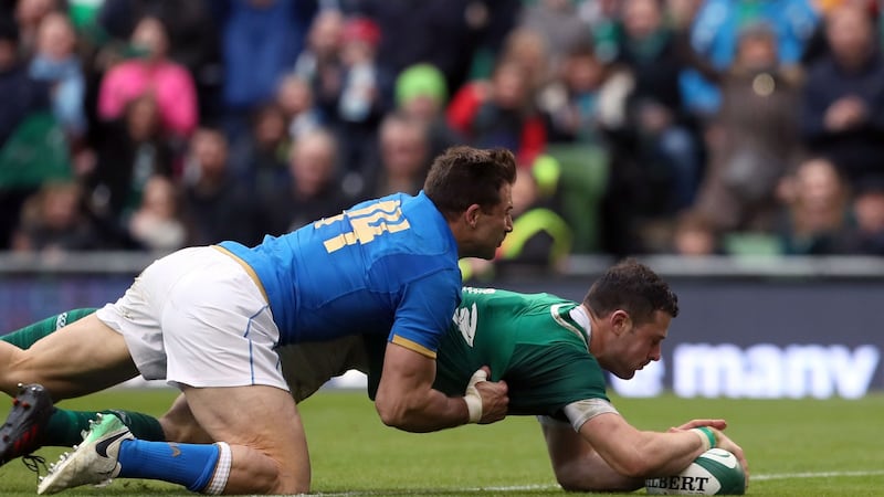 Ireland’s Robbie Henshaw scores a try during the NatWest Six Nations match at the Aviva Stadium, Dublin, in February, with Italy’s Tommaso Benvenuti on his back. Photograph: Brian Lawless/PA Wire