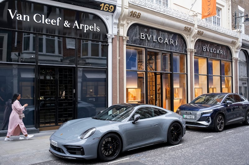 A Porsche parked outside Bvlgari and Van Cleef & Arpels on Bond Street in London. Photograph: Mike Kemp/In Pictures via Getty Images