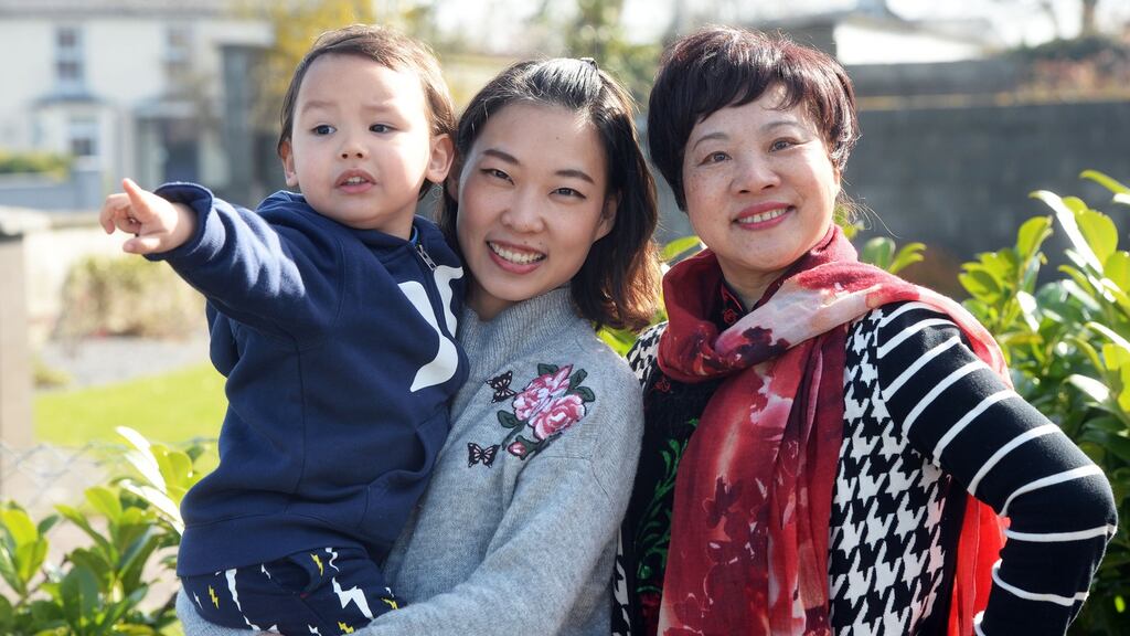 Yi Huang with her son, Oisín, and her mother, Li Li, who is on a visit from China. Photograph: Eric Luke