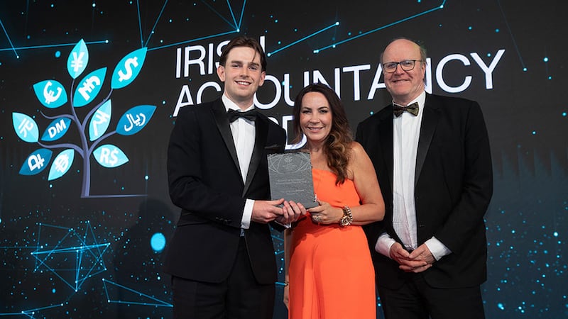 Sean Darmody, sales marketing coordinator at Search4less, presents the best use of technology in accounting and finance – SME award to Gillian Cregan and Paul Egan, The Law Society of Ireland