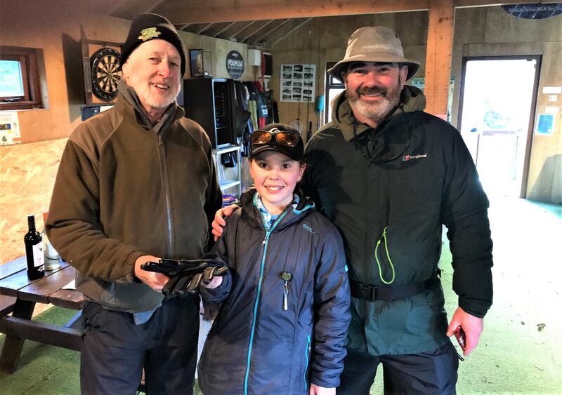Proprietor Brian Nally (left), with Sebastian (11) and his dad Tony Wright from Kilpedder, at the Christmas fly-fishing get-together at Annamoe Trout Fishery in Co Wicklow.
