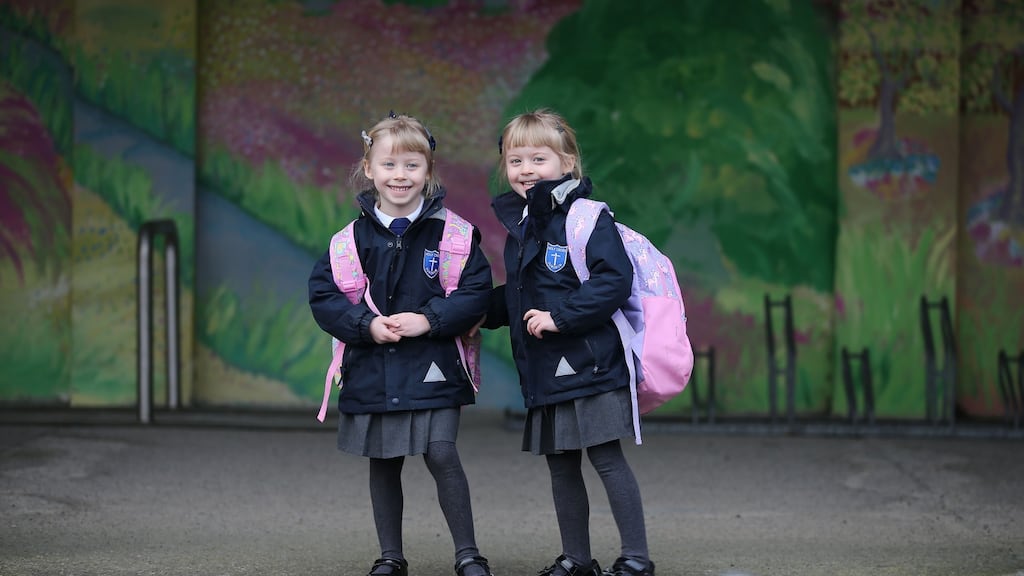 Among the children returning to  Holy Cross School, Dundrum, Co Dublin were 5-year-old twins Holly and Grace McCann. Photograph: Nick Bradshaw