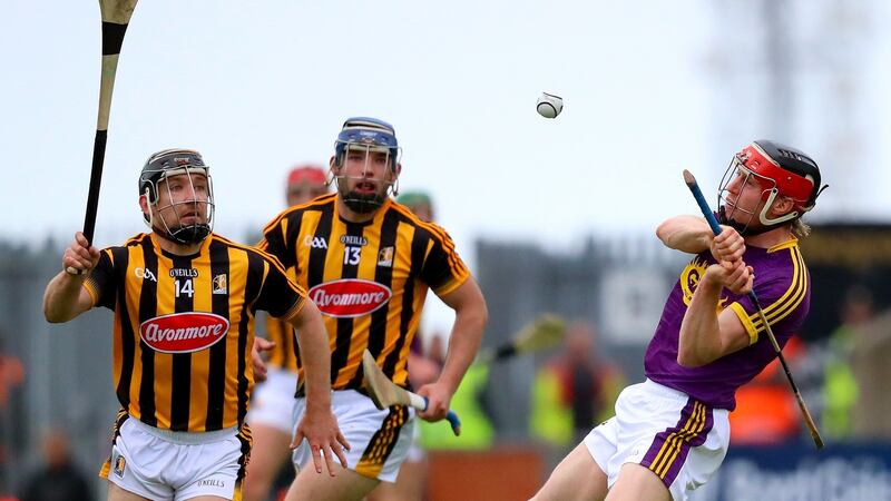 Wexford’s Diarmuid O’Keeffe is closed down by the Kilkenny duo of Richie Hogan and Ger Aylward. Photograph: Oisin Keniry/Inpho