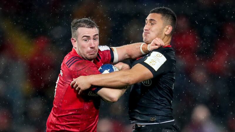 Munster’s JJ Hanrahan is tackled by  Manu Vunipola of Saracens. during the Heineken Champions Cup match at Thomond Park. Photograph: Oisín Keniry/Inpho