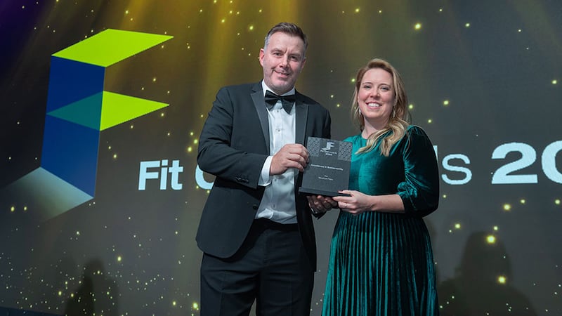 Kevin O'Driscoll, director, partner programmes at BusinessRiver, presents the excellence in sustainability award to Kelly Geoghegan, Structure Tone