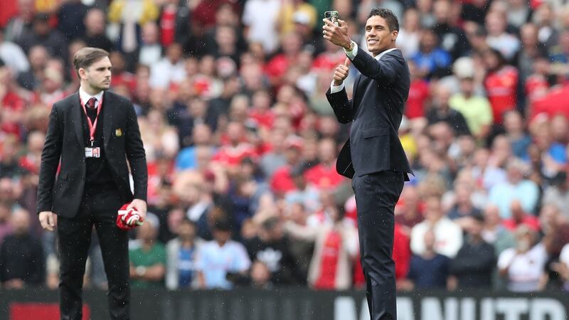 New Manchester United signing Raphael Varane  is introduced to fans  at Old Trafford ahead of the Leeds game. Photograph:  Alex Morton/Getty Images
