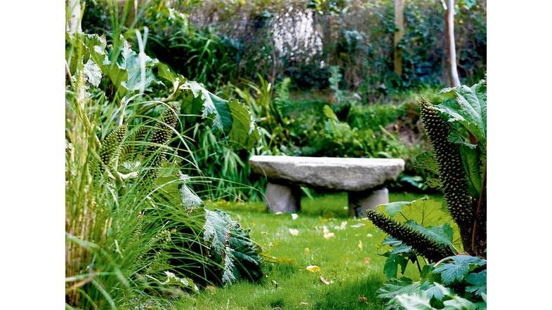 CREATIVE COCOON (clockwise from above left): Pat McCarthy at the entrance to Ballilogue Clochán; the sittingroom; dining room; garden. PHOTOGRAPHS: MARK McCALL