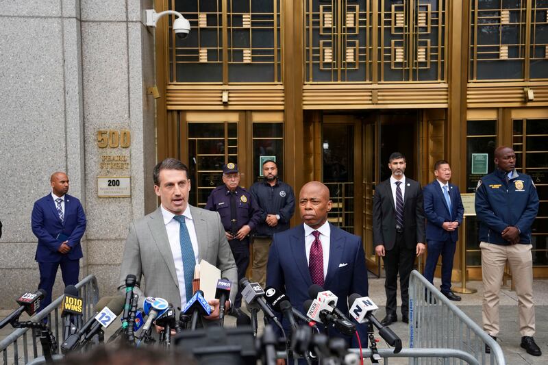 Eric Adams listens as his lawyer, Alex Spiro, speaks to reporters on September 27th. Photograph: Todd Heisler/New York Times
                      
