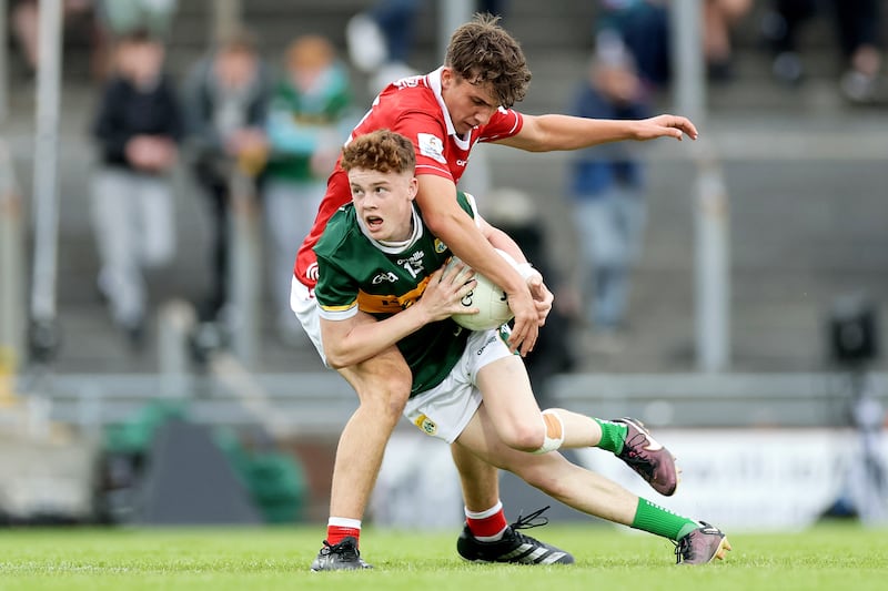 Kerry's Nick Lacey is challenged by Cork's Matthew Kiernan. Photograph: Laszlo Geczo/Inpho