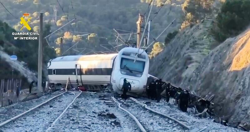The wreck of the Renfe service strewn across both lines. Photograph: Guardia Civil via AP