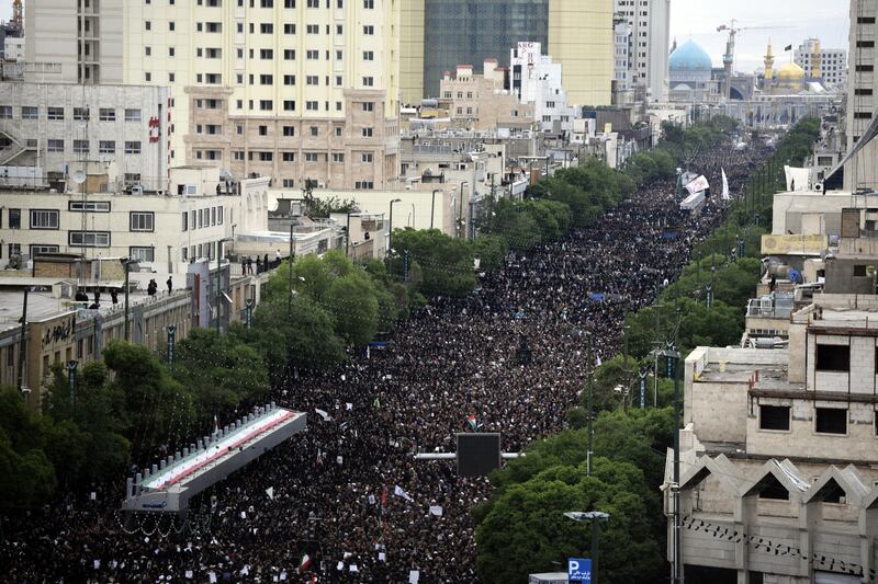 Iranian mourners attend Raisi's funeral in Mashhad. Photograph: Hossein Moameri/Fars News Agency/AFP via Getty Images