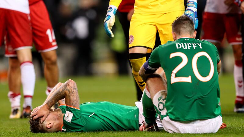 Shane Duffy and Jeff Hendrick after Ireland's defeat to Denmark in 2017. Photograph: James Crombie/Inpho