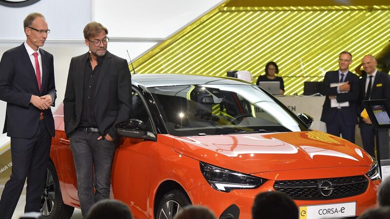 Michael Lohscheller (L), chairman of the Opel with  Liverpool Football Club boss Juergen Klopp at the launch of the new Opel Corsa-e