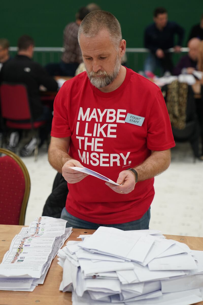 A member of the count staff wears his heart on his chest as counting takes place at Nemo Rangers GAA Club in Cork. Photograph: Jacob King/PA Wire
