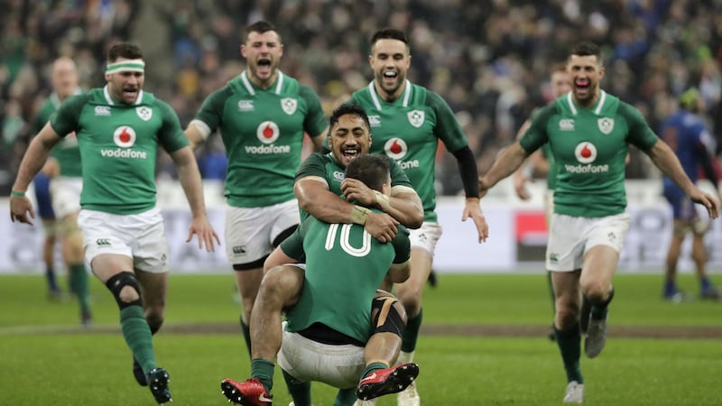 Johnny Sexton celebrates with Bundee Aki after scoring a drop goal to beat France 15-13 in their Six Nations opener at the Stade de France in 2018. Photograph: Thomas Samson/AFP/Getty Images