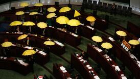 Pro-democracy lawmakers walk out of Hong Kong council over election law