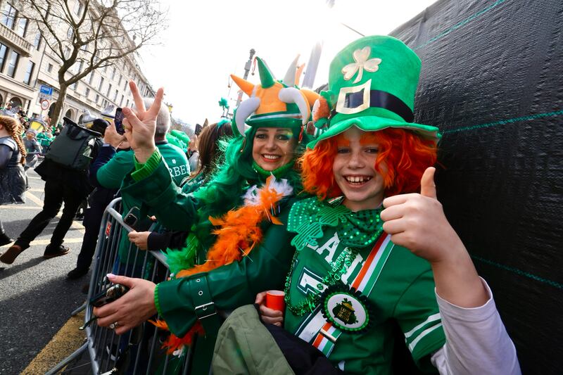 Over 4,200 street performers, pageant companies and marching bands from Ireland and across the world take to the streets of Dublin for the National St. Patrick’s Festival Parade, the biggest ever produced, with a crowd of approximately 500,000 gathered in Dublin City to watch.
Photograph: Alan Betson The Irish Times 


Enjoying the festivities surrounding the St. Patrick’s Day parade in Dublin City.
Photograph:Alan Betson